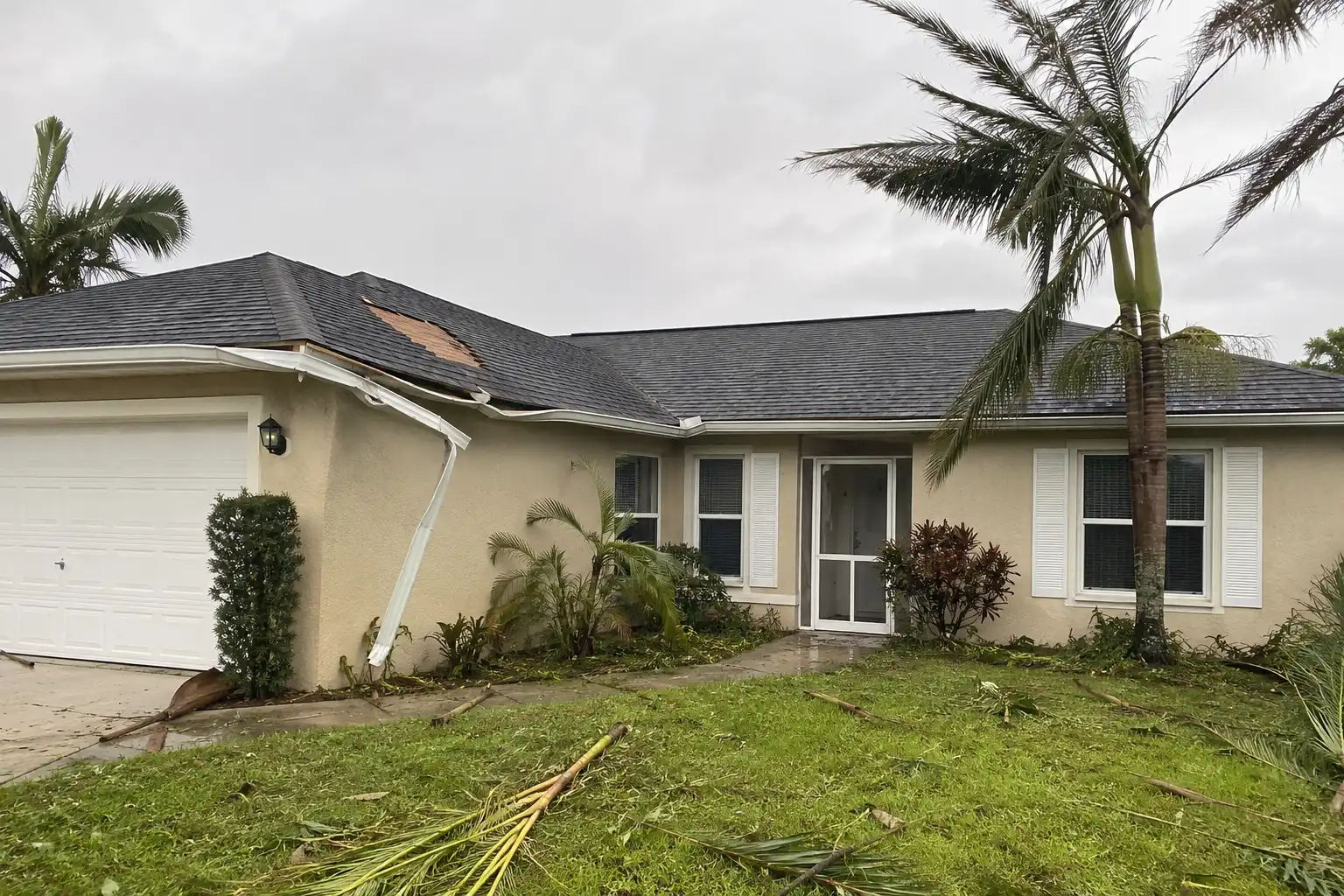 Storm damage with debris and a compromised structure